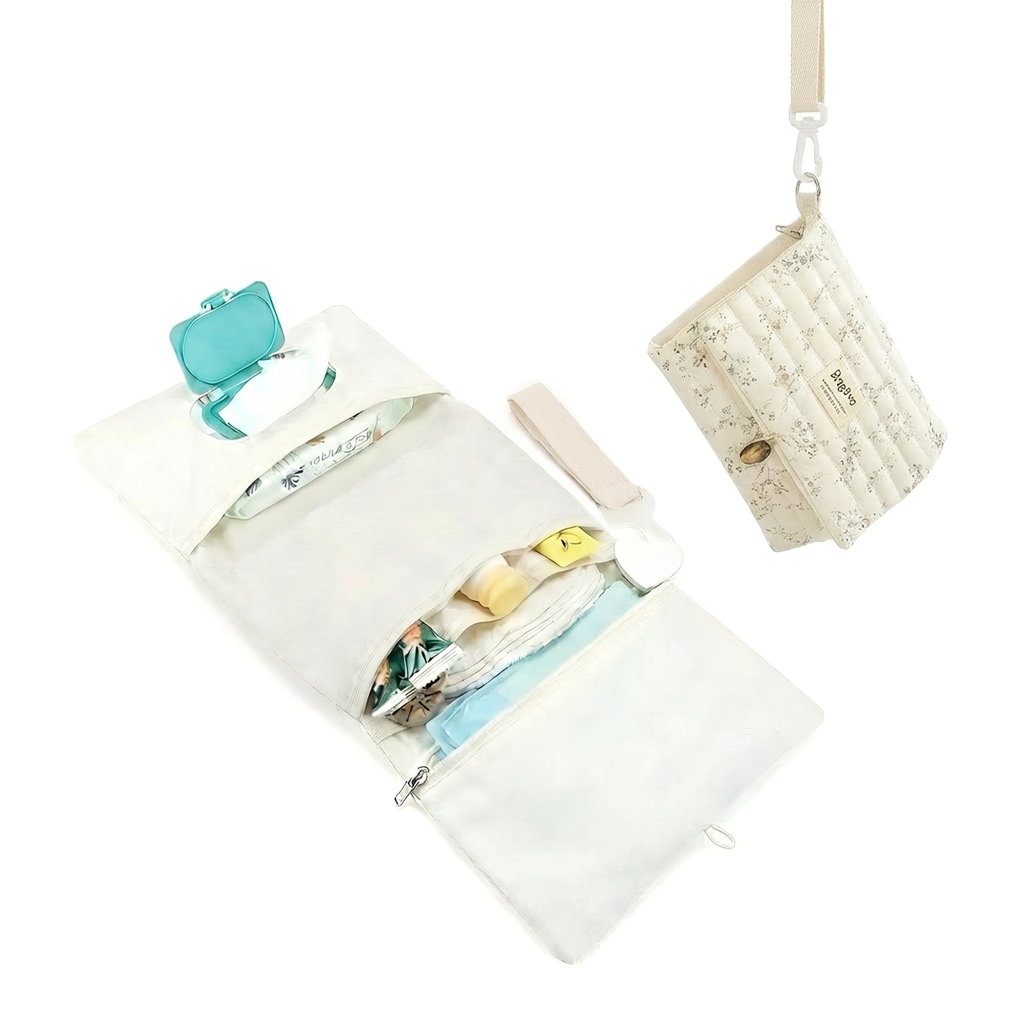 Portable foldable diaper changing clutch unfolded as a padded mat with wipes pocket and folded as a quilted floral crossbody clutch