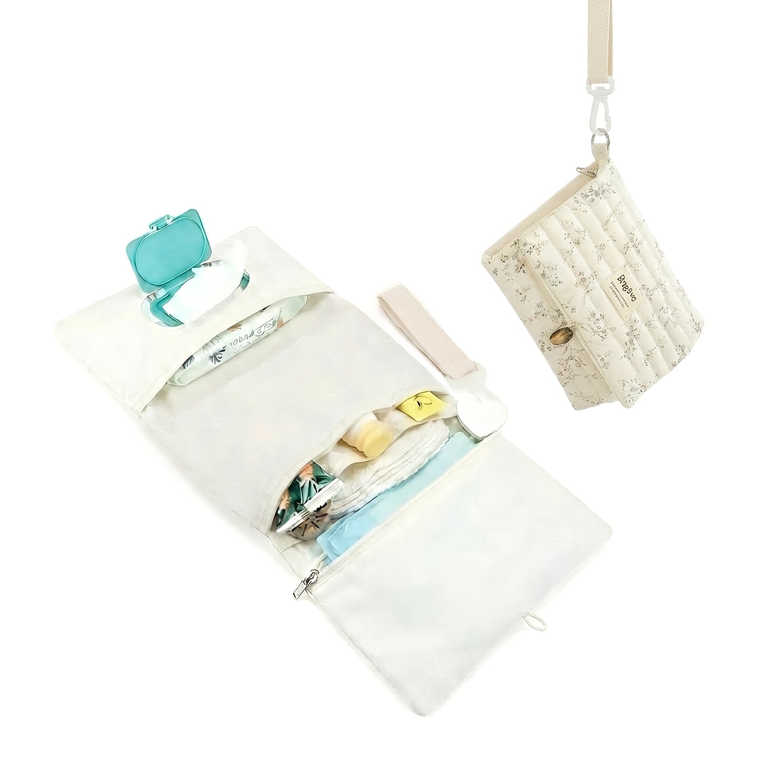Portable foldable diaper changing clutch unfolded as a padded mat with wipes pocket and folded as a quilted floral crossbody clutch